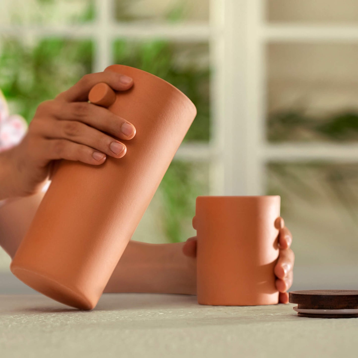 Terracotta carafe with wooden lid